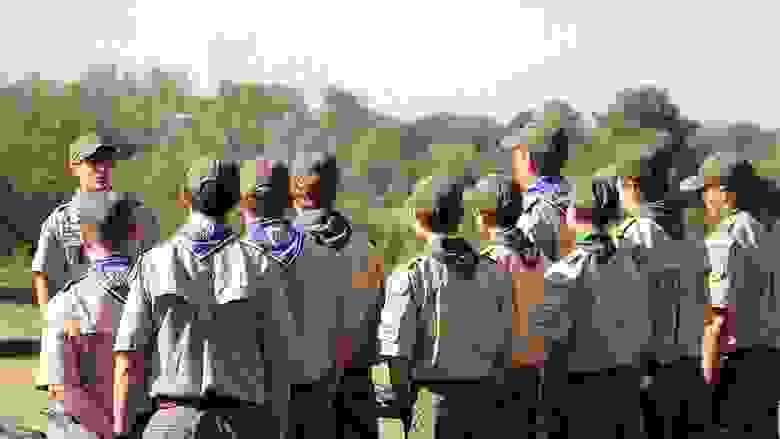 Group of Boy Scouts Listening to their Scout Leader