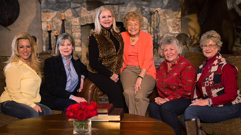 Distinguished NRA Women in Front of a Rock Fireplace