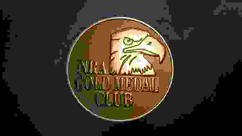 NRA Gold Medal Club Emblem on a Dark Background