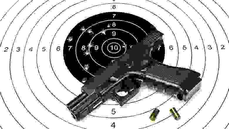 Pistol laying on a black and white target