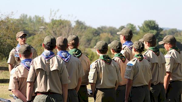 Group of Boy Scouts Listening to their Scout Leader