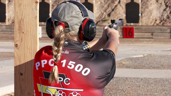 Female PPC Competitor on an Outdoor Range