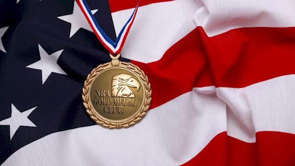 Gold Medal Award Draped Over the United States Flag