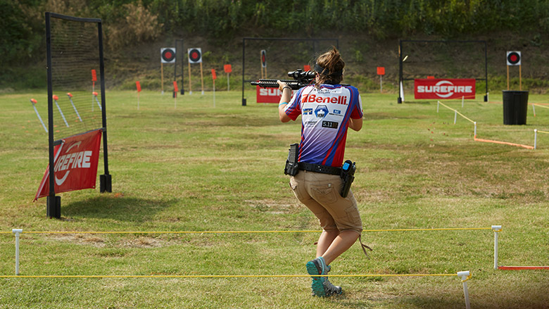 NRA competitor shooting in a competition on an outdoor range
