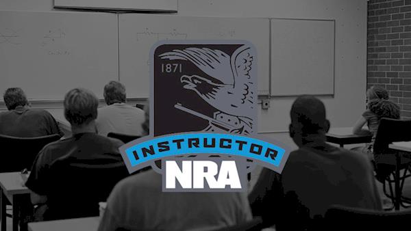 NRA Instructor Logo on a Dark Background of a Classroom