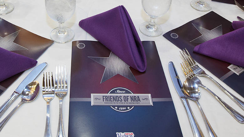 Friends of NRA Banquet Program at a Dinner Table Setting